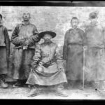 13th Dalai Lama, Thubten Gyatso (1876–1933), centre, with four men standing behind him. MOA Archives. Photo by Lieutenant Colonel Eric Parker