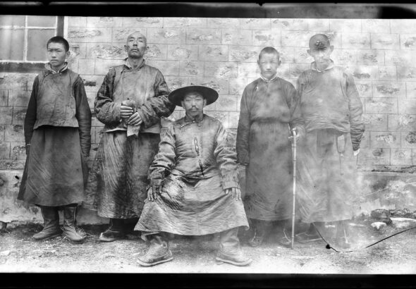13th Dalai Lama, Thubten Gyatso (1876–1933), centre, with four men standing behind him. MOA Archives. Photo by Lieutenant Colonel Eric Parker