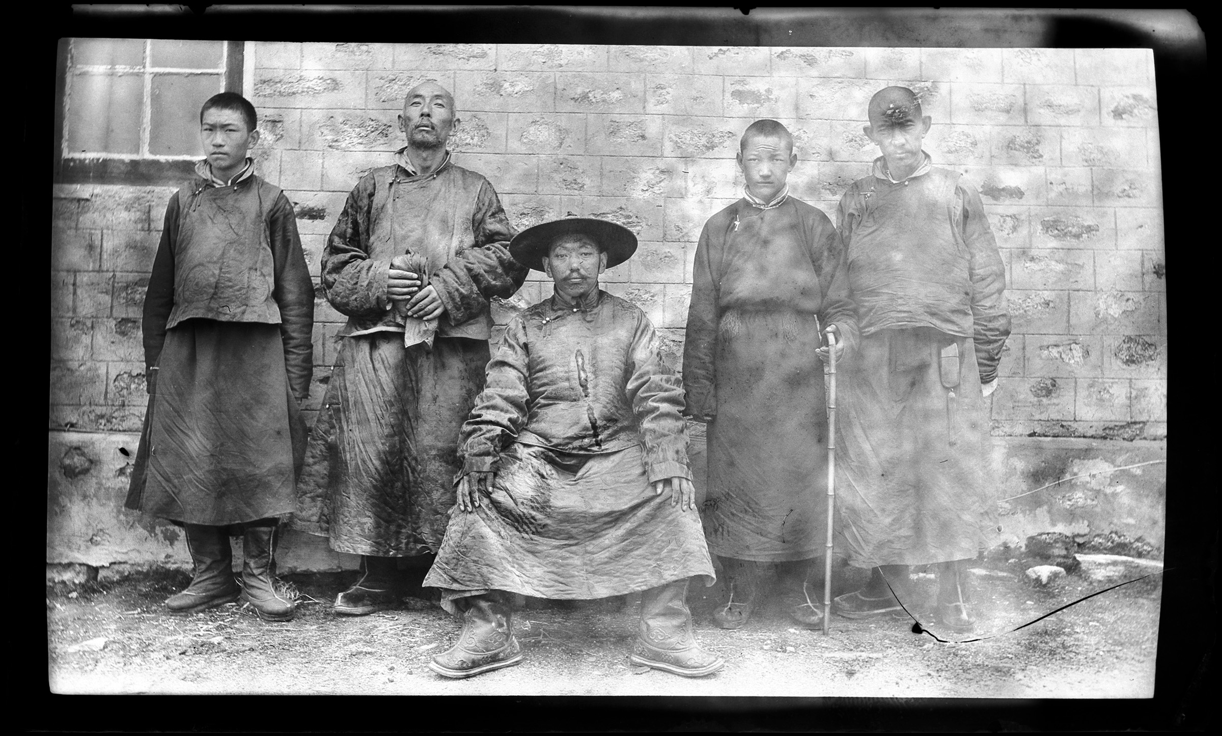 13th Dalai Lama, Thubten Gyatso (1876–1933), centre, with four men standing behind him. MOA Archives. Photo by Lieutenant Colonel Eric Parker