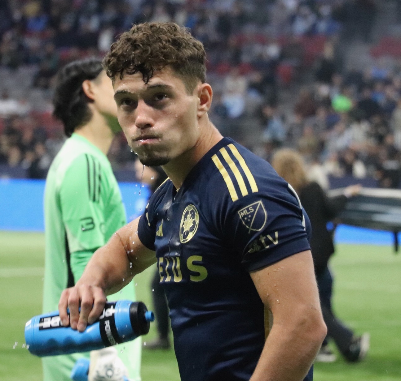 Sebastian Berhalter taking a drink.