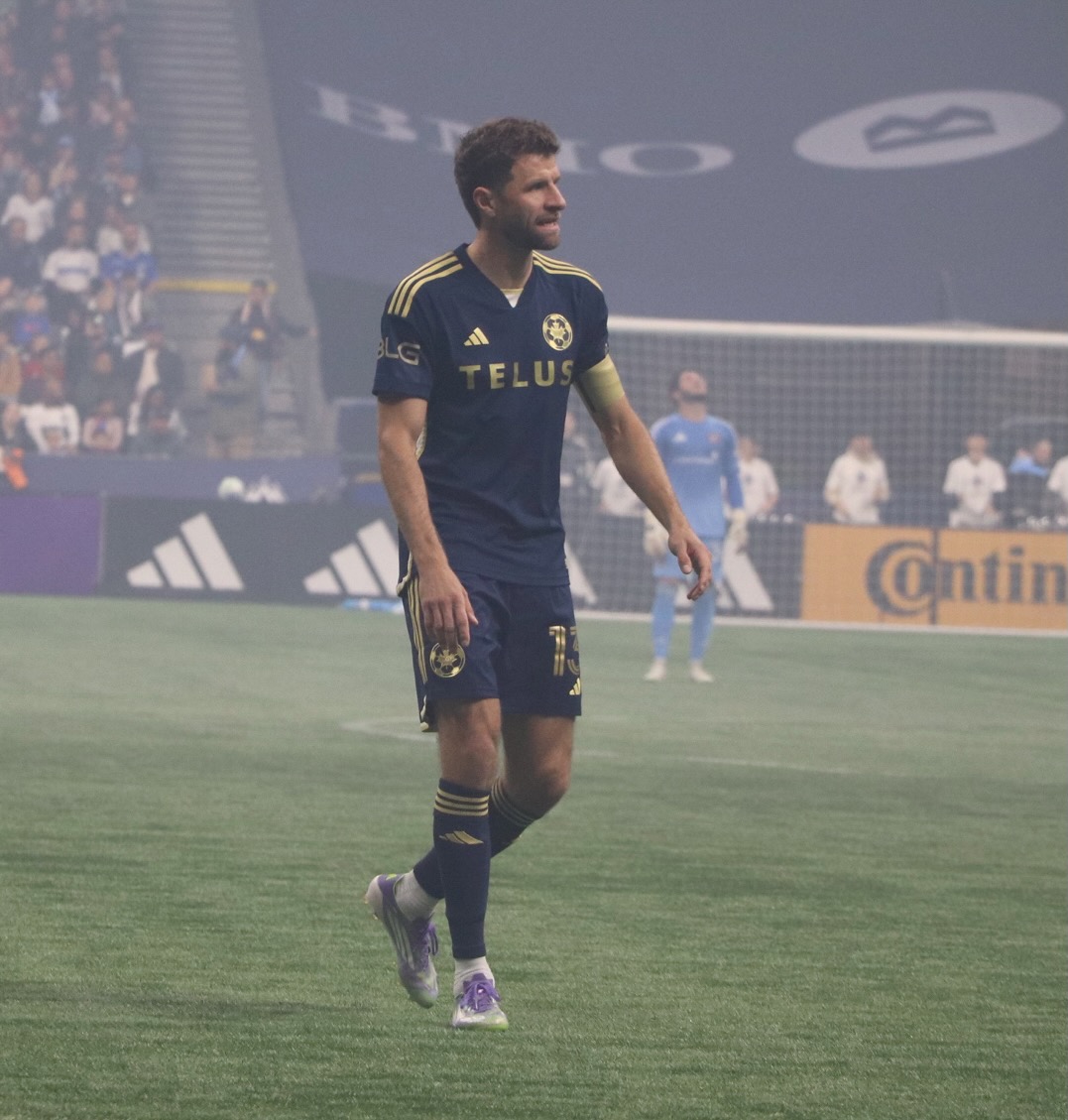 Thomas running for the ball.