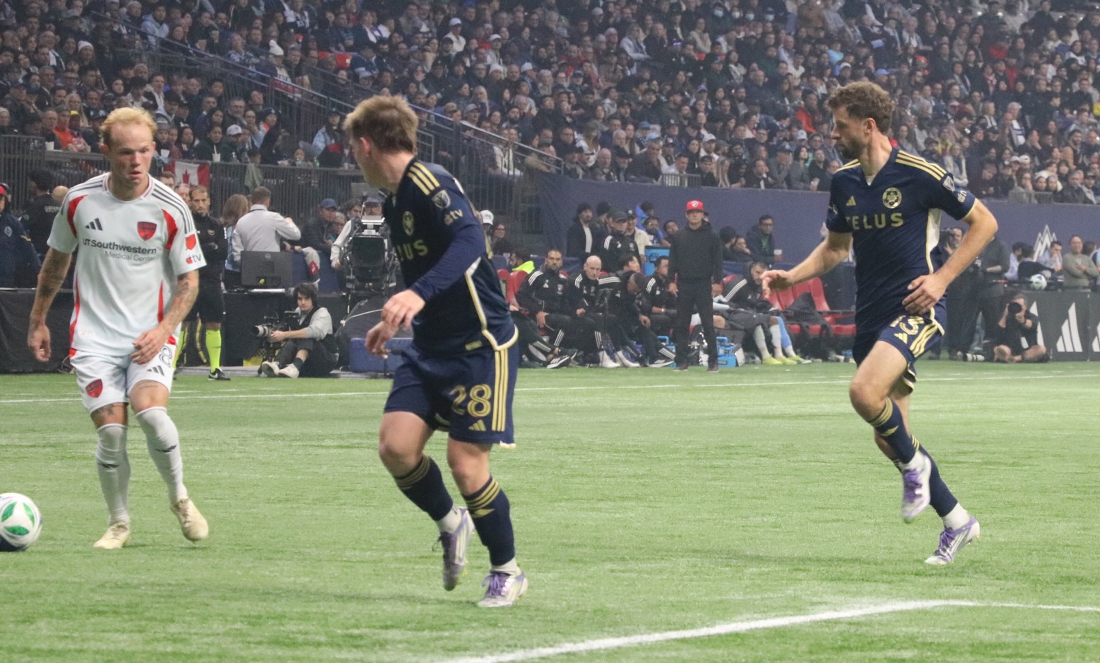 Tate Johnson standing upright while Müller is prancing behind him.