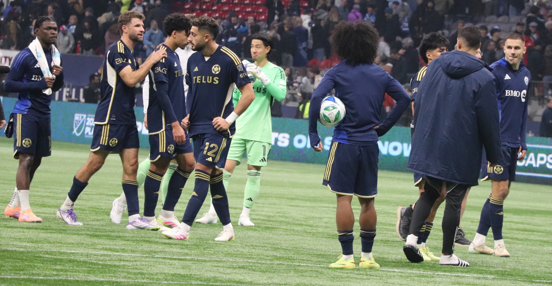 After the game, the team supporting each other.