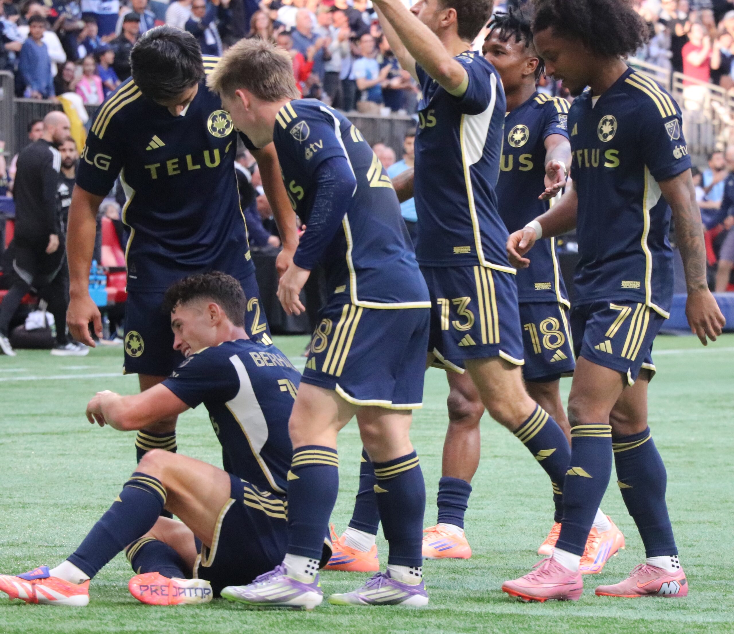 Berhalter went down in the crowd of Whitecaps FC Players.