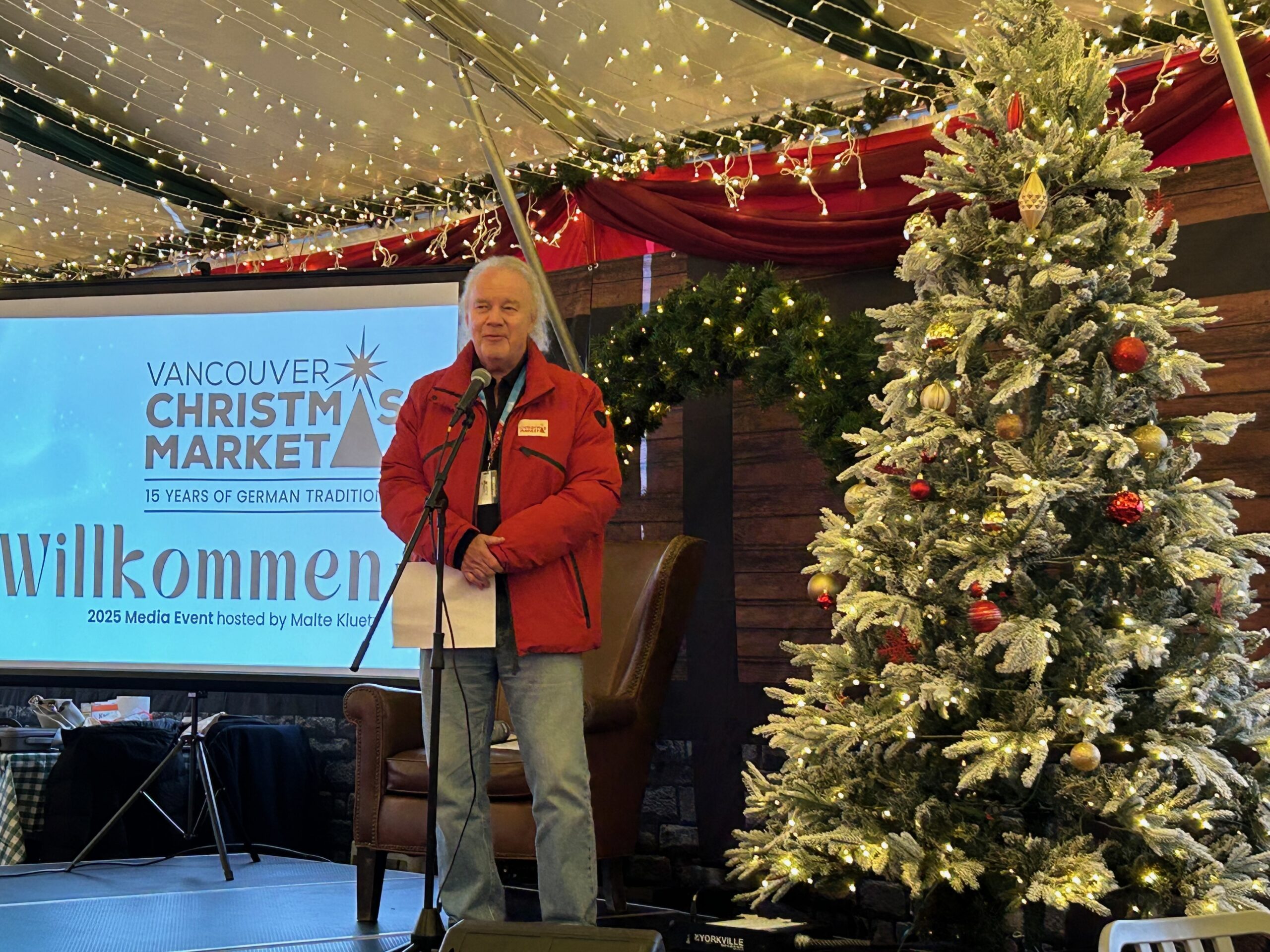 Malte Kluetz introduces the Christmas Market to a crowd of media